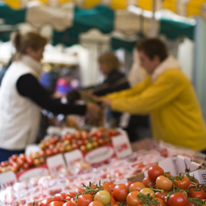 close up of lots of tomatoes at the market