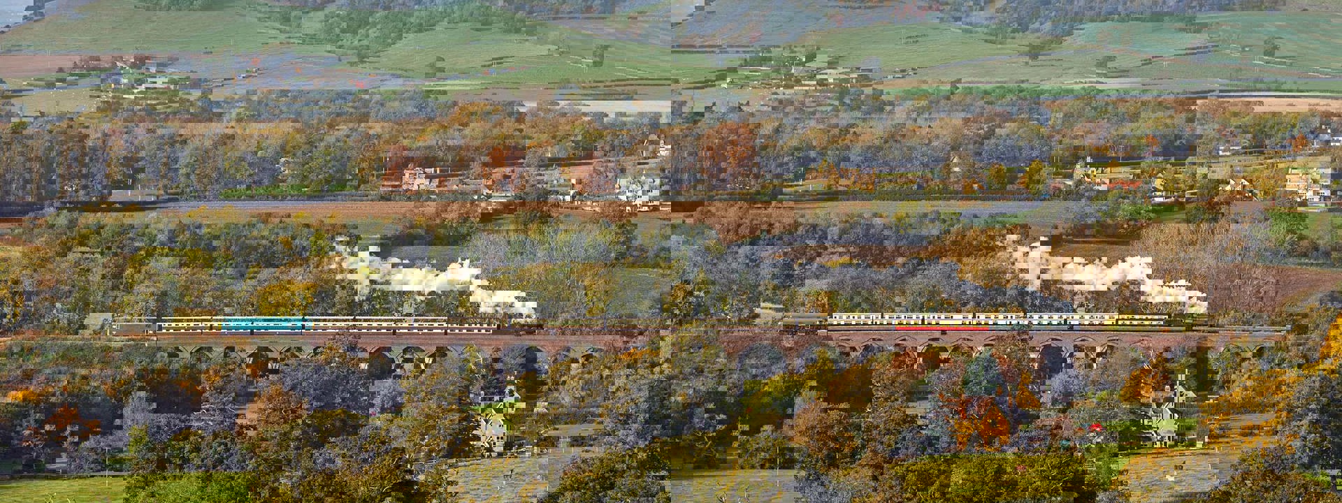 Steam train going over Stanway Viaduct in the Autumn