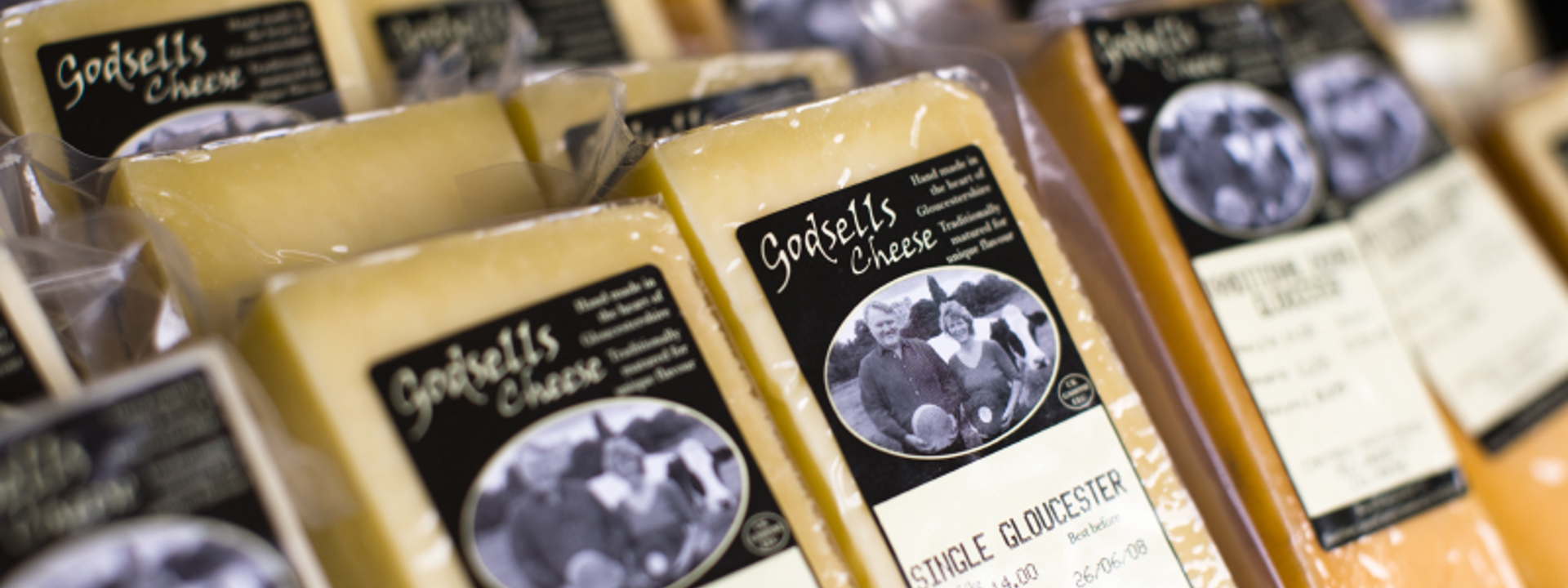 rows of packaged cheeses